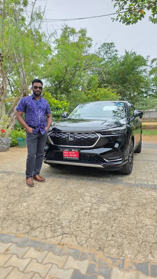 Genuine Automobiles customer with a delivered vehicle, photo 11