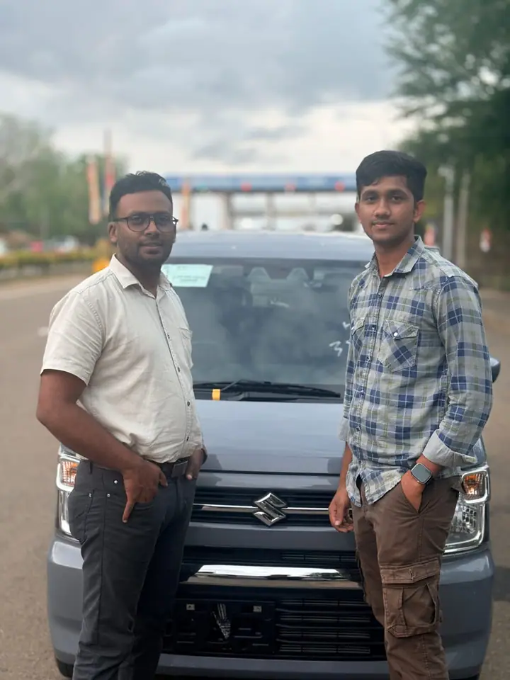 Genuine Automobiles customer with a delivered vehicle, photo 17