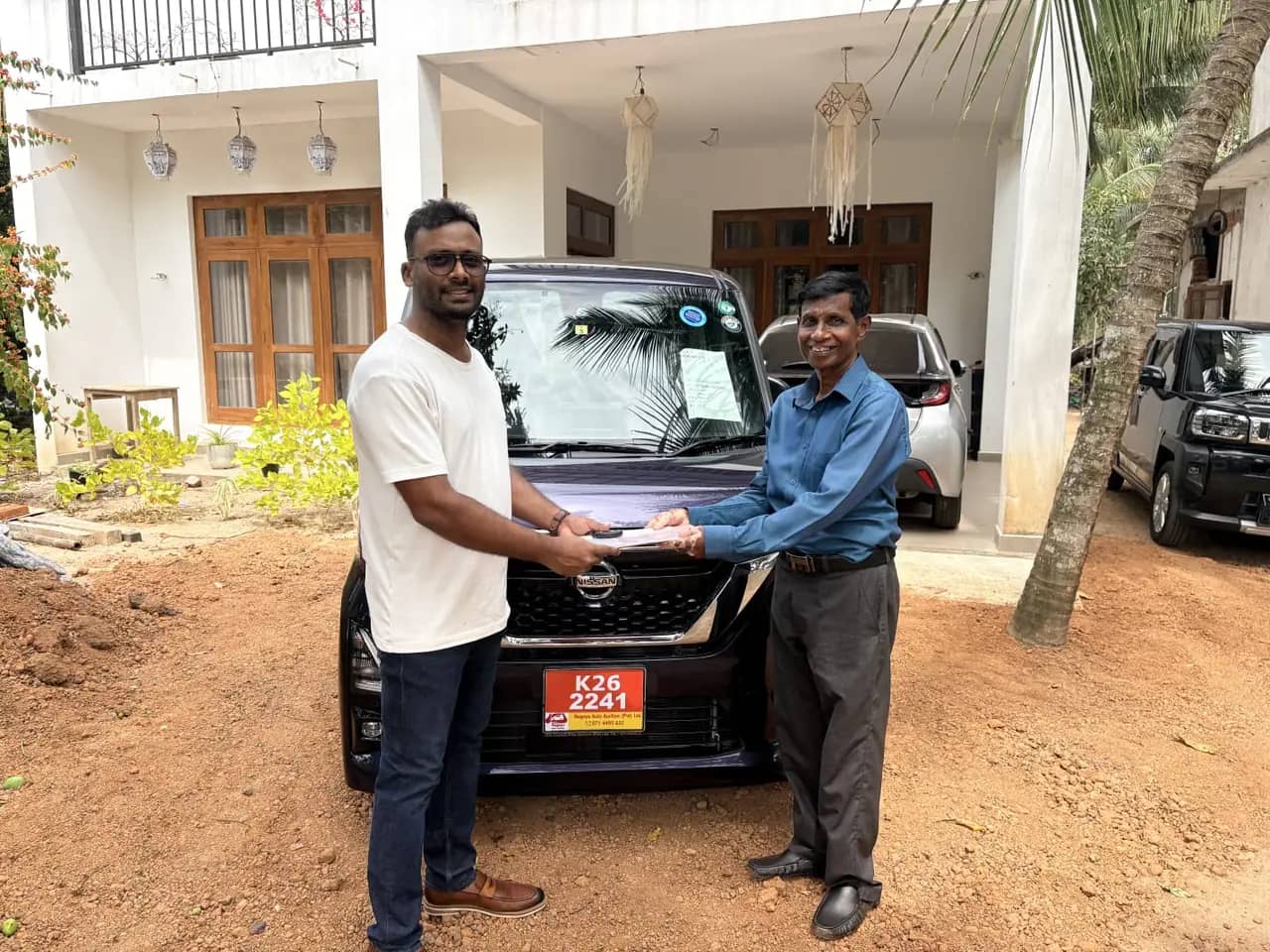 Genuine Automobiles customer with a delivered vehicle, photo 20