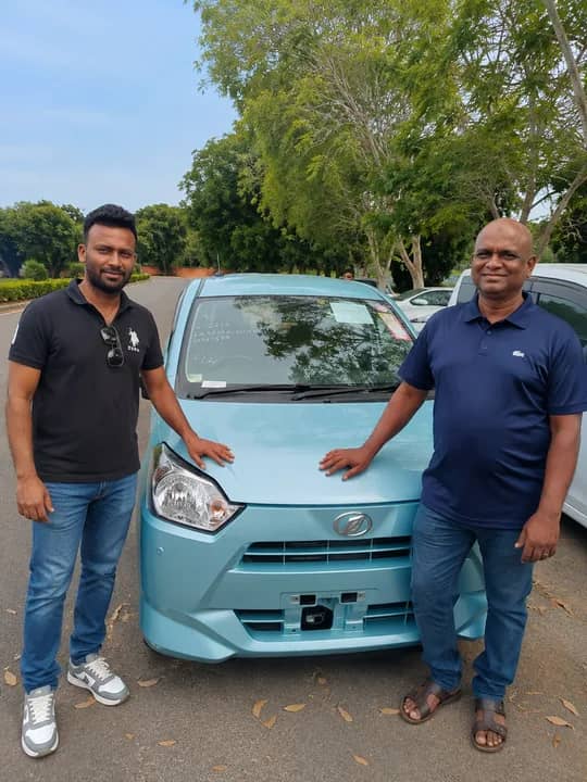 Genuine Automobiles customer with a delivered vehicle, photo 2